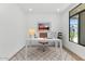 Well-lit home office with modern desk, comfortable chair, and stylish decor for a productive workspace at 6722 N 9Th Dr, Phoenix, AZ 85013