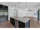 Modern kitchen boasts island sink, stainless dishwasher and is adjacent to the living area at 6722 N 9Th Dr, Phoenix, AZ 85013