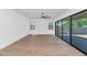 Spacious living area features sliding glass doors to backyard and sleek wood floors at 6722 N 9Th Dr, Phoenix, AZ 85013