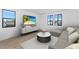 Modern living room featuring entertainment center, ample seating, and black framed windows at 6722 N 9Th Dr, Phoenix, AZ 85013