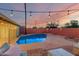 Beautiful backyard pool with outdoor lights, creating a tranquil and inviting atmosphere for relaxation at 6932 E Latham St, Scottsdale, AZ 85257