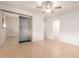 Spacious bedroom with a ceiling fan, closet, and a neutral color scheme offers a serene retreat at 6932 E Latham St, Scottsdale, AZ 85257