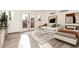 Bright, modern bedroom featuring a white couch, gray bed, and large windows for plenty of natural light at 6932 E Latham St, Scottsdale, AZ 85257