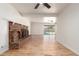 Bright living room with hardwood floors, fireplace, and sliding door access to the backyard at 6932 E Latham St, Scottsdale, AZ 85257