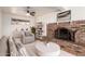 Comfortable living room with fireplace, open shelving, and modern decor elements at 6932 E Latham St, Scottsdale, AZ 85257