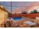 Relaxing backyard pool surrounded by lush landscaping and cozy seating, ideal for warm evenings at 6932 E Latham St, Scottsdale, AZ 85257