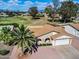 Aerial view of a single-story home with desert landscaping, a two-car garage and mountains in background at 811 S 79Th Way, Mesa, AZ 85208
