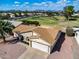 Aerial view of single-story home with desert landscaping, palm trees, and a two-car garage at 811 S 79Th Way, Mesa, AZ 85208