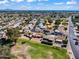 Picture of a well-planned community with neatly arranged homes, complemented by lush green spaces and palm trees at 811 S 79Th Way, Mesa, AZ 85208