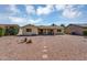 Spacious backyard featuring desert landscaping, a stone path, and a covered patio at 811 S 79Th Way, Mesa, AZ 85208