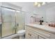 Bathroom featuring a frosted glass enclosed shower and updated vanity with granite countertop at 811 S 79Th Way, Mesa, AZ 85208