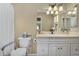 Bright bathroom with a single vanity, mirror, and toilet with accessibility features at 811 S 79Th Way, Mesa, AZ 85208