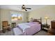 Relaxing bedroom with a large window, neutral colors, and classic wood furniture at 811 S 79Th Way, Mesa, AZ 85208