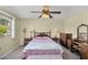 Comfortable bedroom with a large window, soft lighting, and classic wood furniture at 811 S 79Th Way, Mesa, AZ 85208