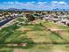Community dog park featuring a wide open grassy area and metal fencing under blue skies with mountain views at 811 S 79Th Way, Mesa, AZ 85208