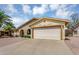 Lovely single-story home featuring a two-car garage, brick accents, and a well-maintained driveway at 811 S 79Th Way, Mesa, AZ 85208