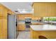 Well-equipped kitchen with stainless steel appliances, ample cabinets, and tiled backsplash at 811 S 79Th Way, Mesa, AZ 85208