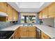 Bright kitchen featuring stainless steel appliances, granite countertops, and natural lighting at 811 S 79Th Way, Mesa, AZ 85208