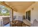 Covered patio with tiled floor, brick pillars, iron railing, sliding glass door and outdoor seating at 811 S 79Th Way, Mesa, AZ 85208