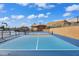 Community pickleball court featuring two tone blue court design with nearby desert landscaping and recreational buildings at 811 S 79Th Way, Mesa, AZ 85208