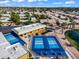Aerial view of community pickleball courts and a beautiful pond in a well-maintained neighborhood at 811 S 79Th Way, Mesa, AZ 85208