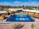Aerial view of neighborhood pickleball courts, adjacent to community buildings, offering residents recreational opportunities at 811 S 79Th Way, Mesa, AZ 85208
