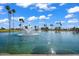 Scenic community pond with fountains, palm trees, lush greenery, and tranquil water features at 811 S 79Th Way, Mesa, AZ 85208