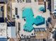 Aerial view of a pool and whirlpool with lounge chairs and tables surrounding the pool area at 811 S 79Th Way, Mesa, AZ 85208