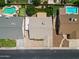 Aerial view of a home showing the roof, yard, and nearby swimming pools at 8943 W Sierra Vista Dr, Glendale, AZ 85305