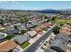 Aerial view of the neighborhood showcasing houses and a distant stadium at 8943 W Sierra Vista Dr, Glendale, AZ 85305