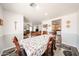 A dining area featuring wood-look floors and a table with six chairs, adjacent to living areas at 8943 W Sierra Vista Dr, Glendale, AZ 85305
