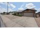 Ranch style home with a two-car garage and desert landscaping at 8943 W Sierra Vista Dr, Glendale, AZ 85305