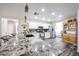 Well-lit kitchen featuring granite countertops, stainless appliances, and white cabinetry at 8943 W Sierra Vista Dr, Glendale, AZ 85305
