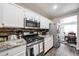 Well-equipped kitchen with granite counters, stainless appliances, and ample counter space at 8943 W Sierra Vista Dr, Glendale, AZ 85305