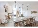Open kitchen featuring granite countertops, pendant lighting, and seating at the island at 8943 W Sierra Vista Dr, Glendale, AZ 85305