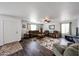 Bright living room with hardwood floors, ceiling fan, and comfortable seating at 8943 W Sierra Vista Dr, Glendale, AZ 85305