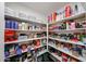Walk-in pantry with white shelving, stocked with plenty of food and cooking supplies at 8943 W Sierra Vista Dr, Glendale, AZ 85305