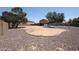 Spacious backyard features a pool area and desert landscaping, offering a blank canvas for customization at 9243 W Palmer Dr, Peoria, AZ 85345