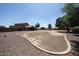 Large backyard with desert landscape and a pool, perfect for outdoor enjoyment and potential customization at 9243 W Palmer Dr, Peoria, AZ 85345