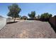 A large fenced backyard features a pool with a stone surround and low-maintenance landscaping at 9243 W Palmer Dr, Peoria, AZ 85345