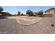 Spacious backyard featuring desert landscaping with a pool and a designated area for entertaining at 9243 W Palmer Dr, Peoria, AZ 85345