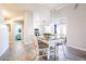 Open dining area with vaulted ceilings and views to kitchen and bathroom at 9243 W Palmer Dr, Peoria, AZ 85345