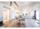Open dining area and kitchen with stairs to the upper level at 9243 W Palmer Dr, Peoria, AZ 85345