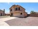 Stucco home with a two-car garage, desert landscaping, a side gate and an open backyard at 9243 W Palmer Dr, Peoria, AZ 85345