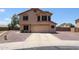 Two-story stucco home featuring a neutral color palette, desert landscaping, and an attached two-car garage at 9243 W Palmer Dr, Peoria, AZ 85345