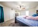 Large primary bedroom with ceiling fan, furnishings, and decor at 9243 W Palmer Dr, Peoria, AZ 85345