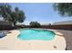 The pool features a rock waterfall accent, stone surround, and a lounge chair at 9243 W Palmer Dr, Peoria, AZ 85345