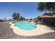 Inviting pool with lounge chairs, surrounded by desert landscaping and a privacy fence, perfect for relaxing at 9243 W Palmer Dr, Peoria, AZ 85345