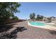 Inviting pool with lounge chairs, surrounded by desert landscaping and a privacy fence, perfect for relaxing at 9243 W Palmer Dr, Peoria, AZ 85345