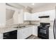 Well-lit kitchen showcases granite counters, modern appliances, and white cabinetry at 925 E Agua Fria Ln, Avondale, AZ 85323